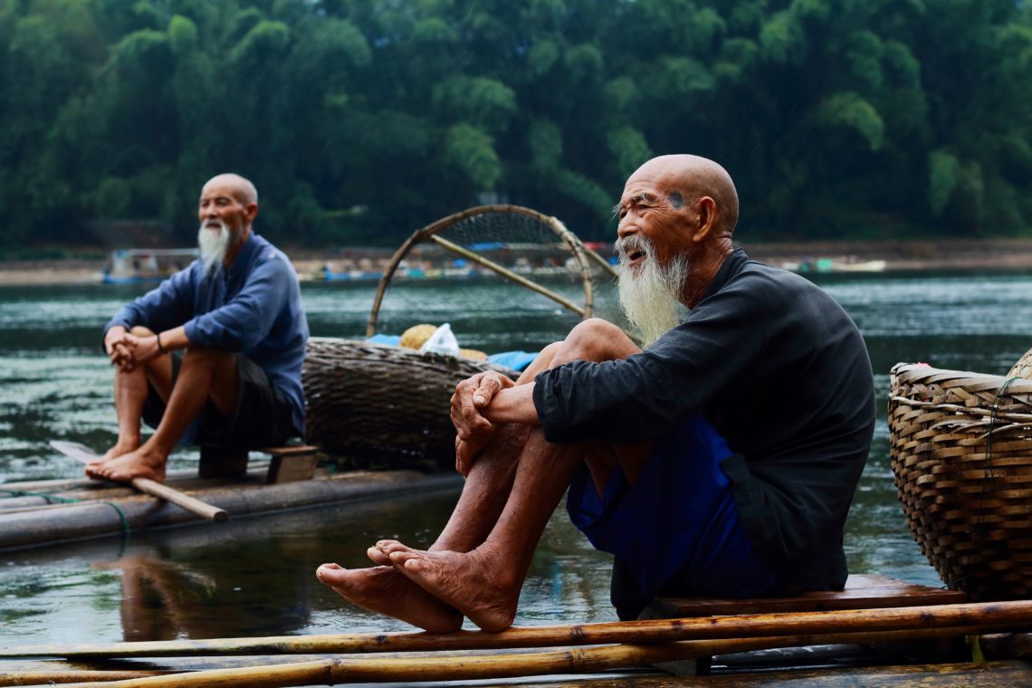 RadioMarocCulture Two Men Sitting On Riverbank 247519